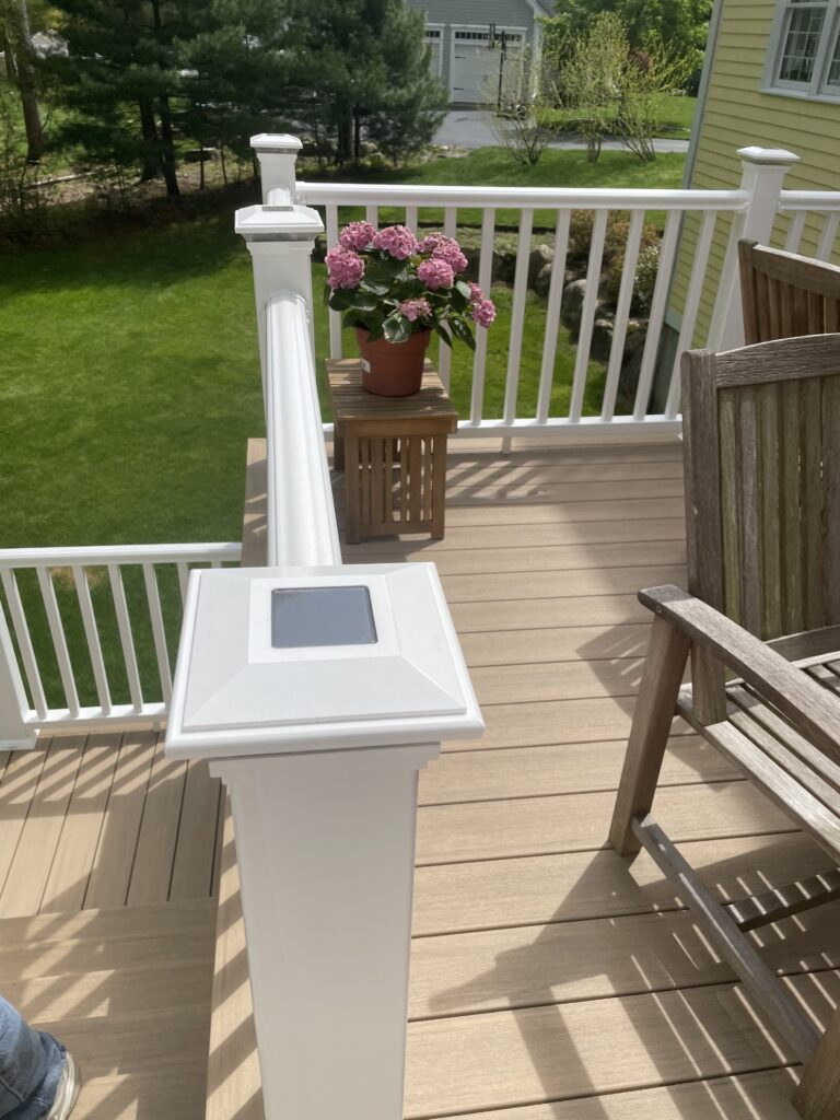 Experienced Deck Builder in Marshfield constructing a custom wooden deck