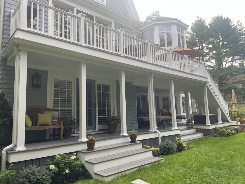 Two-story house with porch and balcony.